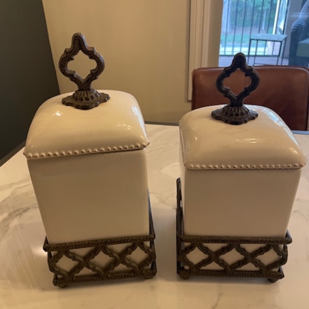 Cream and iron work canisters